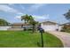 Charming single-story home featuring a well-maintained front yard, palm trees, and a mailbox at 7851 120Th St, Seminole, FL 33772