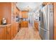 Well-lit kitchen with stainless steel appliances and view of the living area at 7851 120Th St, Seminole, FL 33772
