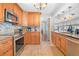This renovated kitchen features stainless appliances, and upgraded tile backsplash at 7851 120Th St, Seminole, FL 33772