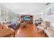 Bright living room with wood floors, comfortable seating, and large windows with plantation shutters at 7851 120Th St, Seminole, FL 33772