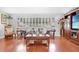 Inviting living room featuring wood floors, comfortable sofa, and an entertainment center at 7851 120Th St, Seminole, FL 33772