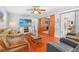 Spacious living room with hardwood floors and a modern entertainment center at 7851 120Th St, Seminole, FL 33772