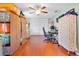 Office space with ample storage, a ceiling fan, and wood flooring at 7851 120Th St, Seminole, FL 33772