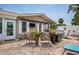 Inviting patio with an awning, wicker chairs, potted plants, and an outdoor seating area for relaxing and entertaining at 7851 120Th St, Seminole, FL 33772