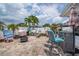 Spacious outdoor patio featuring a fire pit, grill, patio furniture, and lounge area perfect for outdoor entertainment at 7851 120Th St, Seminole, FL 33772
