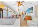 Bright sunroom with tile floors, comfortable seating, and outdoor views at 7851 120Th St, Seminole, FL 33772