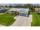 Inviting home with a well-manicured lawn and a lengthy private driveway at 817 Eagle Ln, Apollo Beach, FL 33572