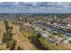 Aerial view of waterfront homes along canals, showcasing community layout and nearby wetland landscape at 817 Eagle Ln, Apollo Beach, FL 33572