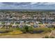Waterfront homes line canals in an aerial view of a tranquil residential neighborhood with boat docks at 817 Eagle Ln, Apollo Beach, FL 33572