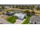 Stunning aerial view of a home with golf course frontage in a waterfront community at 817 Eagle Ln, Apollo Beach, FL 33572