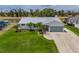 Charming home with pristine landscaping, complemented by an attached two-car garage at 817 Eagle Ln, Apollo Beach, FL 33572