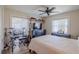 Bedroom featuring wood look tile flooring, a ceiling fan, and bright windows at 817 Eagle Ln, Apollo Beach, FL 33572