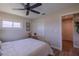 Bedroom featuring wood look tile flooring, a ceiling fan, and a closet at 817 Eagle Ln, Apollo Beach, FL 33572