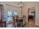 Charming dining area with a view of the screened porch off the back of the home at 817 Eagle Ln, Apollo Beach, FL 33572