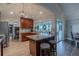 Modern kitchen featuring granite countertops, dark wood cabinetry, stainless steel appliances, and eat in dining at 817 Eagle Ln, Apollo Beach, FL 33572