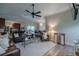 Spacious living room area with wood-look floors and an open floorplan to the kitchen at 817 Eagle Ln, Apollo Beach, FL 33572