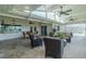 Enjoy outdoor living in the screened lanai with multiple ceiling fans and comfortable seating at 817 Eagle Ln, Apollo Beach, FL 33572