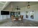 The screened-in lanai with travertine flooring is ideal for relaxing and watching TV at 817 Eagle Ln, Apollo Beach, FL 33572