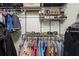 Organized closet with metal shelving and rods displaying clothing, shoes, and accessories at 8401 Ashford Pl, Trinity, FL 34655