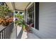 Relaxing front porch provides a comfortable outdoor space with scenic views and a tranquil atmosphere at 8401 Ashford Pl, Trinity, FL 34655