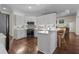 Modern kitchen equipped with white cabinets, granite countertops, and stainless steel appliances at 8401 Ashford Pl, Trinity, FL 34655