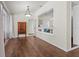Spacious living room featuring hardwood floors and a convenient pass-through to the dining room at 8401 Ashford Pl, Trinity, FL 34655
