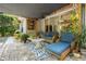 Inviting covered patio with comfortable seating and stylish decor, perfect for outdoor relaxation at 8401 Ashford Pl, Trinity, FL 34655