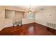 Spacious dining room with hardwood floors, chandelier and access to the entryway at 8517 Woodwick Ct, Tampa, FL 33615