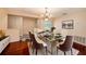 Bright dining room with a chandelier and seating for six, perfect for entertaining guests and Gathering at 8517 Woodwick Ct, Tampa, FL 33615