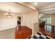 Elegant dining room featuring hardwood floors, a chandelier, and an open layout flowing seamlessly into the living room at 8517 Woodwick Ct, Tampa, FL 33615