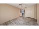 Neutral living room featuring neutral walls and floors and access to other rooms at 8517 Woodwick Ct, Tampa, FL 33615