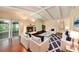Inviting living room with a cozy fireplace, vaulted ceilings, and sliding glass doors for plenty of natural light at 8517 Woodwick Ct, Tampa, FL 33615