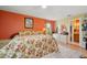 This stylish bedroom boasts light wood floors, neutral walls, and an adjoining bathroom at 9018 39Th N Ln # 5, Pinellas Park, FL 33782