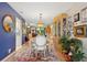 Elegant dining room with hardwood floors, classic furnishings, and a view into the living room at 9018 39Th N Ln # 5, Pinellas Park, FL 33782