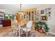 Formal dining area with wood table, seating for six, and large decorative cabinet at 9018 39Th N Ln # 5, Pinellas Park, FL 33782