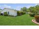Well-manicured lawn and landscaping surrounds the exterior of this home at 9018 39Th N Ln # 5, Pinellas Park, FL 33782