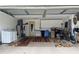 The garage provides a practical space with laundry facilities and storage cabinets at 9018 39Th N Ln # 5, Pinellas Park, FL 33782