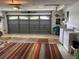 Spacious garage featuring laundry area, overhead door, and ample room for storage and parking at 9018 39Th N Ln # 5, Pinellas Park, FL 33782