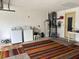 A functional garage space includes a laundry area, water heater, and a door to the outside at 9018 39Th N Ln # 5, Pinellas Park, FL 33782
