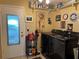 Charming laundry room with well-lit space, shelving, decor, and modern appliances at 9018 39Th N Ln # 5, Pinellas Park, FL 33782