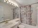 Bathroom featuring a shower-tub combination and decorative shower curtain at 934 Lucas Ln, Oldsmar, FL 34677