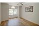 Empty room featuring hardwood floors, and a large window at 934 Lucas Ln, Oldsmar, FL 34677