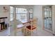 Cozy dining area with a wood table and four chairs, near a bright window with natural light at 934 Lucas Ln, Oldsmar, FL 34677
