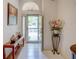 Bright foyer with tiled floors, transom window, and stylish decor at 934 Lucas Ln, Oldsmar, FL 34677