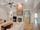 Bright living room with vaulted ceiling, fireplace, and open layout at 934 Lucas Ln, Oldsmar, FL 34677