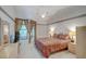 Bedroom featuring a ceiling fan, carpet, a full bed and a doorway to an outdoor patio at 934 Lucas Ln, Oldsmar, FL 34677