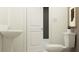 Bathroom featuring modern fixtures, a pedestal sink, and a clean, bright aesthetic for everyday use at 10217 Trumpet Honeysuckle Way, San Antonio, FL 33576