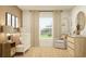 Cozy Bedroom features a white crib, comfortable armchair, and rustic wooden accents, creating a serene space at 10270 Purple Leaf Ct, Riverview, FL 33578