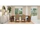 Elegant dining room features a long wooden table with seating for six, with an accent credenza at 10270 Purple Leaf Ct, Riverview, FL 33578