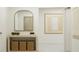 Minimalist entryway with a wooden console table, decorative mirror, baskets, and modern art at 10270 Purple Leaf Ct, Riverview, FL 33578